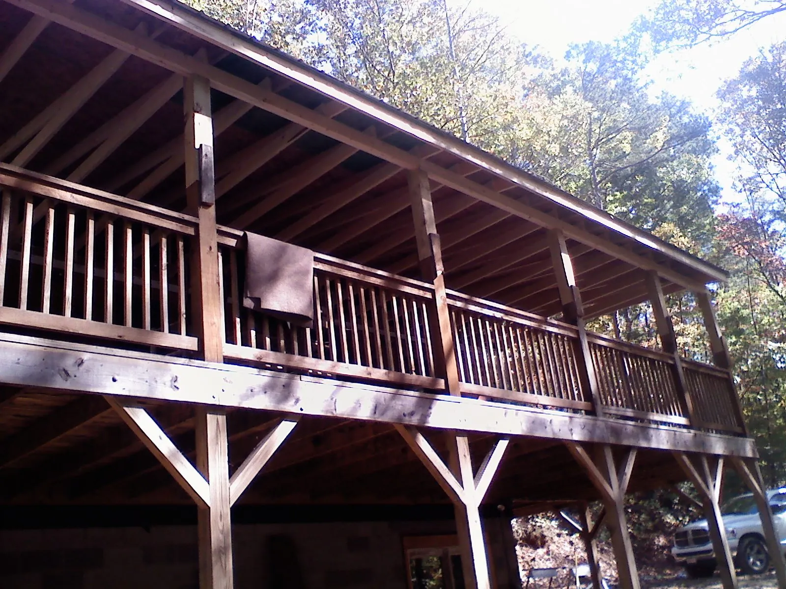 Timber framing under a new elevated porch and deck in Columbus